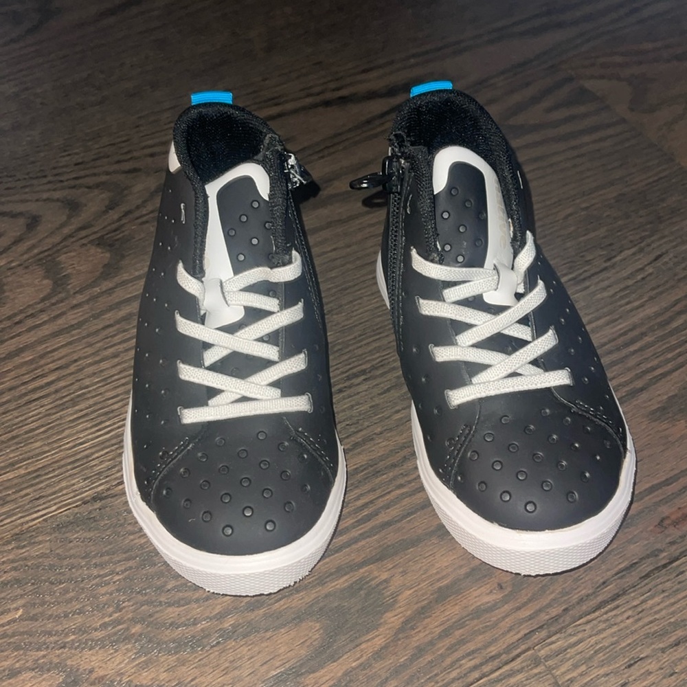 Native black boot with zipper. Size 8. Worn once